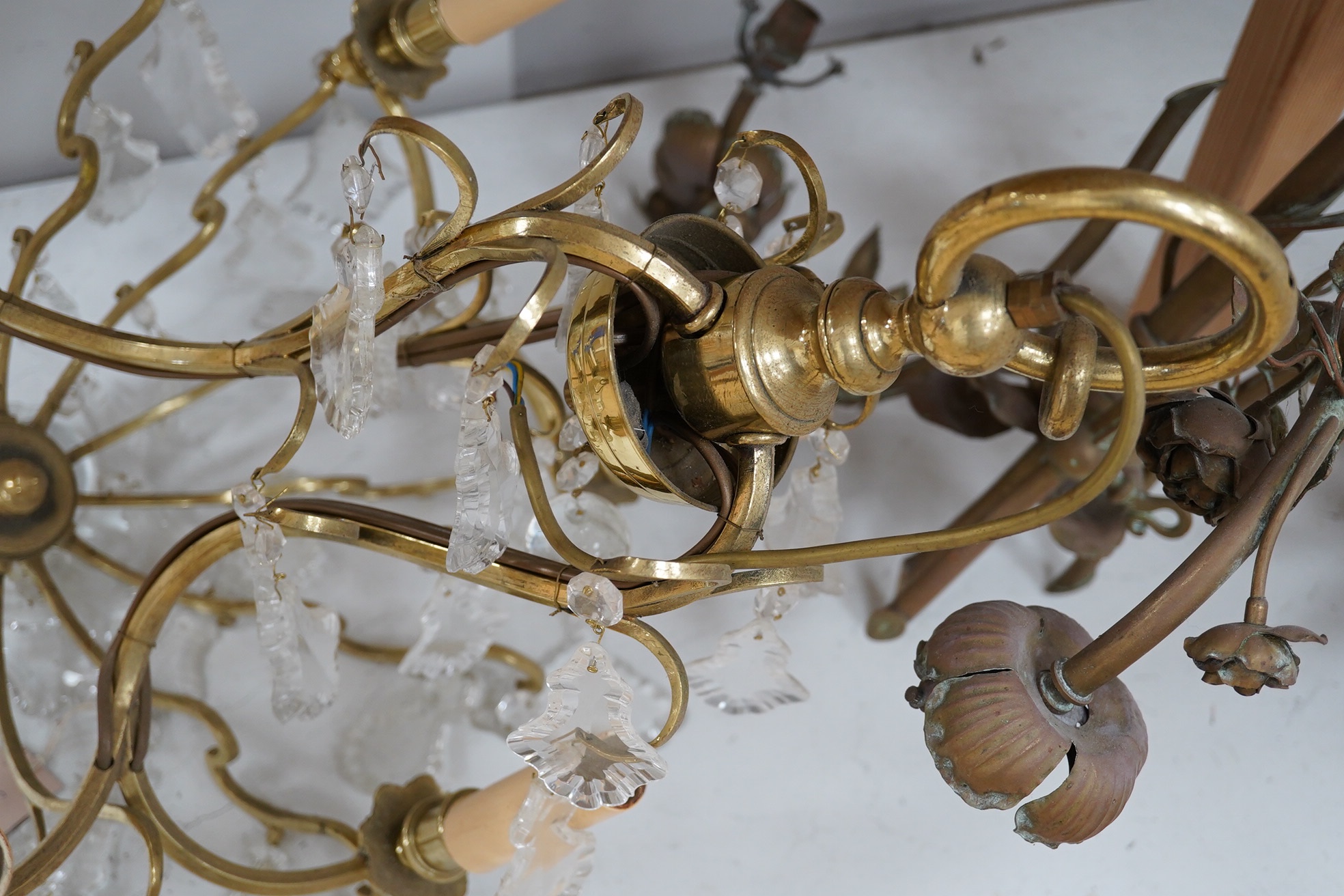 A six light and six branch brass and glass chandelier together with a three branch ornate floral hanging light, longest approximately 66cm. Condition - good